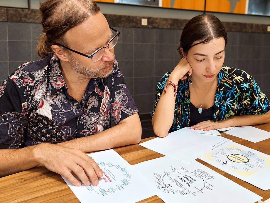Two writers working on story structure